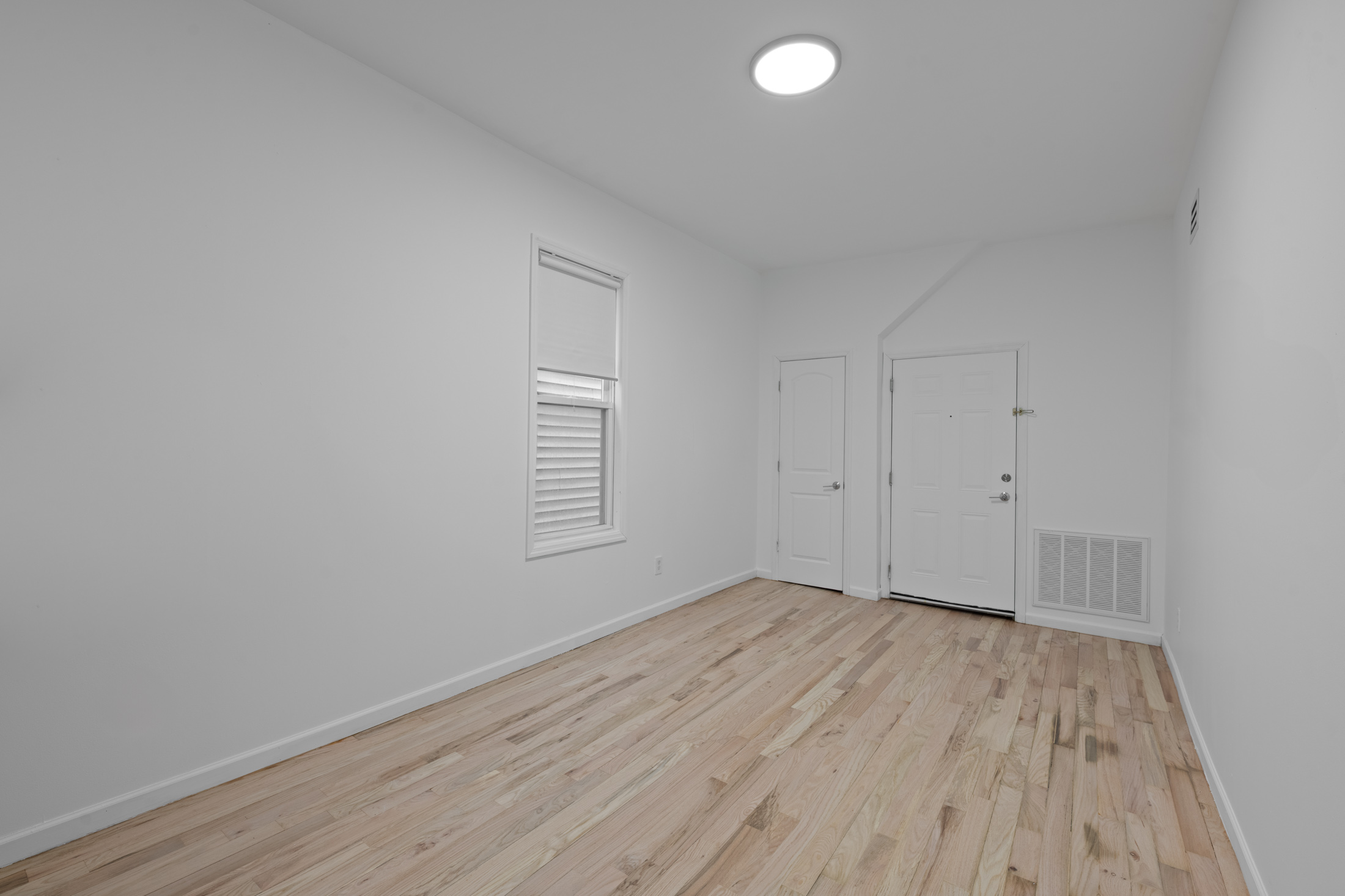 Spacious bedroom with large windows